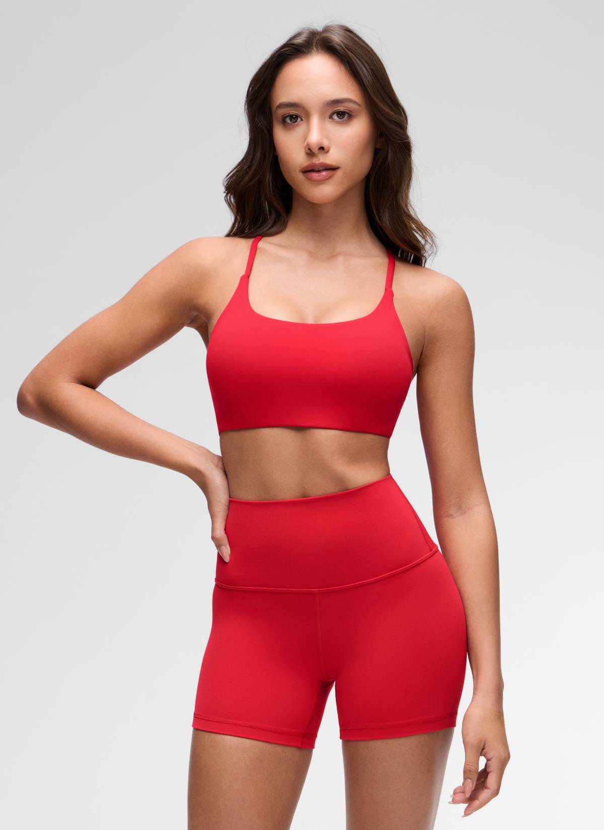 CRZ YOGA Women's Butterluxe Yoga Scoop Neck Twist Cross Back Sport Bra Aurora Red @model_info:Maria